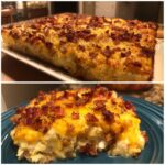 A close-up of a serving of crack chicken casserole topped with melted cheddar cheese and crispy bacon bits.