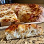 A close-up of a homemade cheese pizza slice, showcasing melted mozzarella and a golden crust.