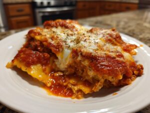 A close-up serving of amazing lazy lasagna, layered with pasta, rich tomato sauce, and melted mozzarella cheese.